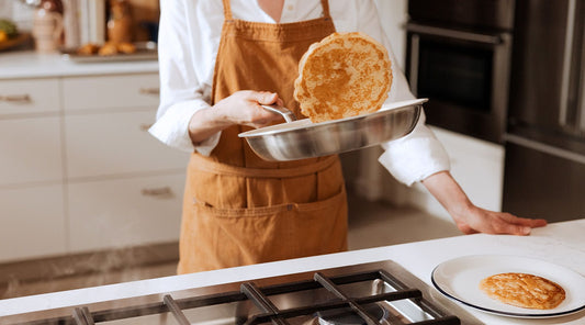 Woman cooking pancakes